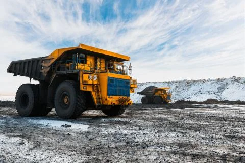 Large quarry dump truck. Loading the rock in dumper. Loading coal into body Stock Photos