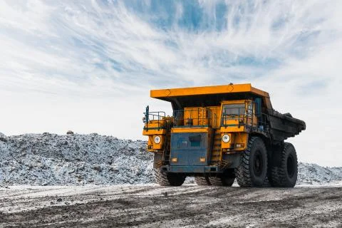 Large quarry dump truck. Loading the rock in dumper. Loading coal into body Fotos Stock