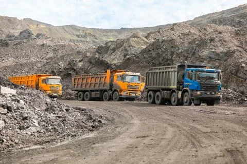 Large quarry dump truck. Loading the rock in dumper. Loading coal into body Stock Photos