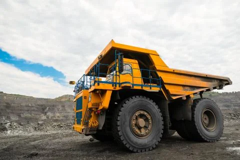 Large quarry dump truck. Loading the rock in dumper. Loading coal into body 写真素材
