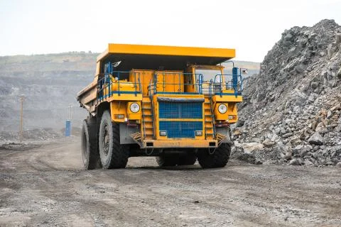 Large quarry dump truck. Loading the rock in dumper. Loading coal into body Fotos Stock
