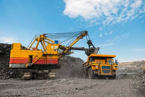 Large quarry dump truck. Loading the rock in dumper. Loading coal into body 写真素材
