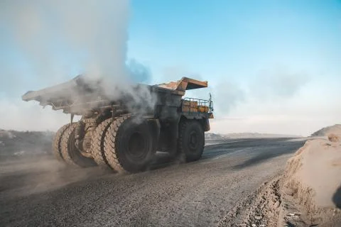 Large quarry dump truck. Loading the rock in dumper. Loading coal into body 写真素材