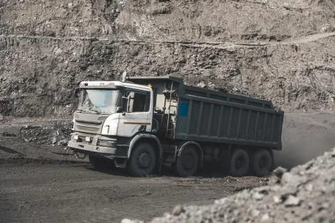 Large quarry dump truck. Loading the rock in dumper. Loading coal into body 写真素材