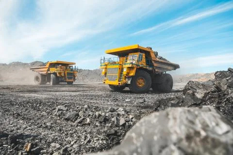 Large quarry dump truck. Loading the rock in dumper. Loading coal into body 写真素材