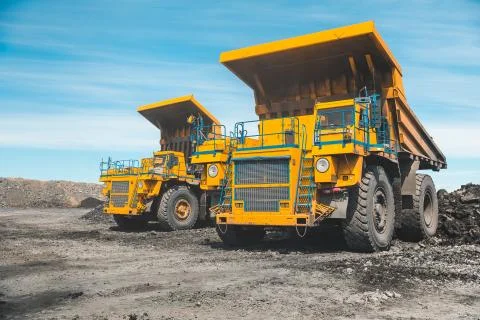 Large quarry dump truck. Loading the rock in dumper. Loading coal into body Stock Photos