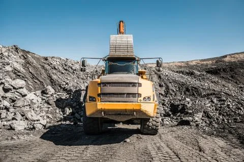 Large quarry dump truck. Loading the rock in dumper. Loading coal into body 写真素材