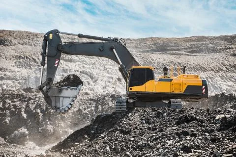 Large quarry dump truck. Loading the rock in dumper. Loading coal into body 写真素材