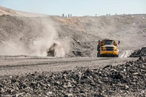 Large quarry dump truck. Loading the rock in dumper. Loading coal into body 写真素材