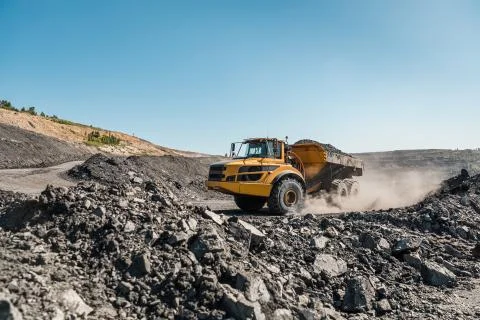 Large quarry dump truck. Loading the rock in dumper. Loading coal into body Stock Photos
