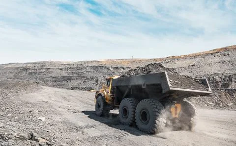 Large quarry dump truck. Loading the rock in dumper. Loading coal into body Stock Photos
