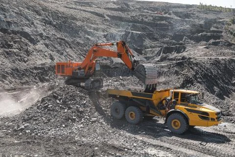 Large quarry dump truck. Loading the rock in dumper. Loading coal into body Stock Photos