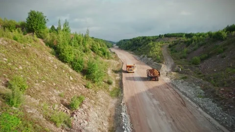 Large quarry dump trucks at work. Stock Footage 205496093