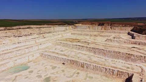 Large quarry site in a rural area shows mining activity in progress Stock Footage 341327260