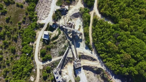 Large quarry site showing equipment and landscape with heavy machinery working Stock Footage 340130980