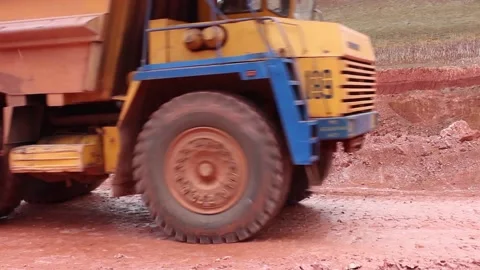 A large quarry truck with minerals moves through the quarry. Close-up. Stock Footage 122215853