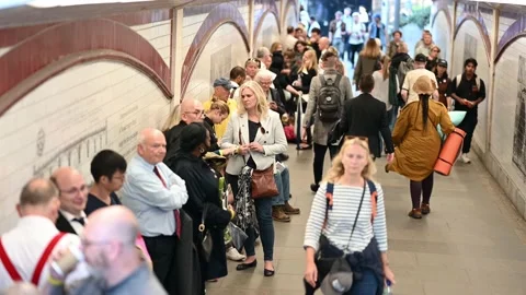 Large queue of people on South Bank of the River Thames to see the Queen Stock Footage 210794601