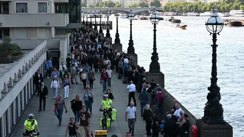 A large queue on South Bank River Thames to see Lying in State Stock Footage 210508093