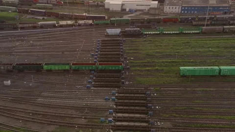 Large railway sorting station. A lot of cars, rails, buildings. View from the Vídeos de archivo 134444494