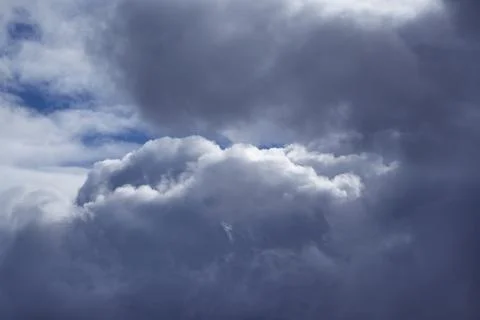 Large rain clouds in the sky close-up, sky before the rain, the arrival of a  Stock Photos