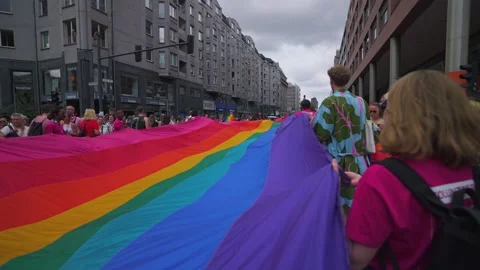 Large Rainbow Flag at Gay Pride Parade March Stock Footage 340504680