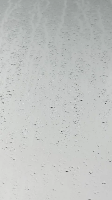 Large Raindrops Streaming Down Big Glass Window Stock Footage 345685083