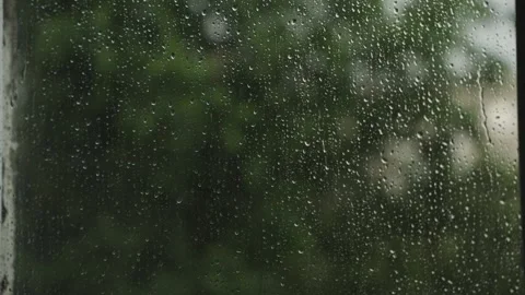 Large raindrops on the window during the rain against the background of the city Video stock 337073247