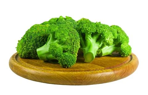 Large raw fresh head of broccoli cabbage on a wooden board, white background, Foto stock