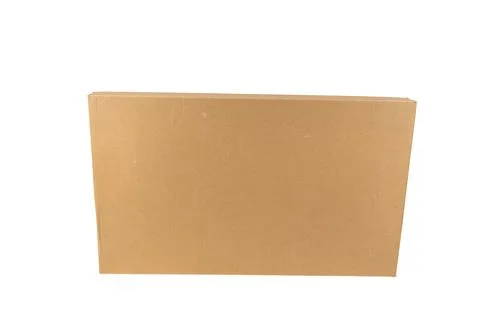A large, rectangular cardboard box stands upright on a white surface. Stock Photos