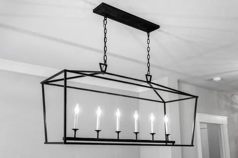 Large Rectangular Chandelier With Six Candle-Style Lights In Modern Dining .. Stock Photos