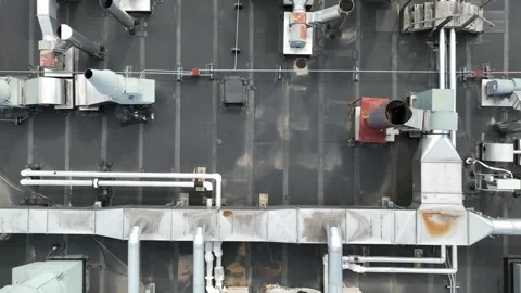 Large rectangular cube ventilation ducts on top of rooftop, aerial top Stock Footage 278657597