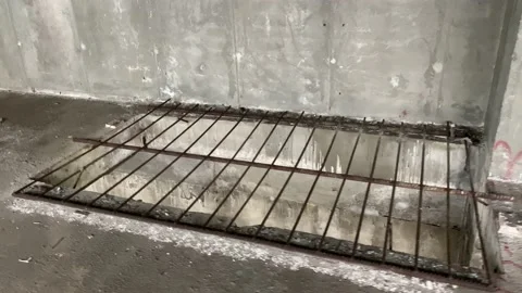 Large rectangular hole in the concrete floor at a construction site Stock Footage 165215036