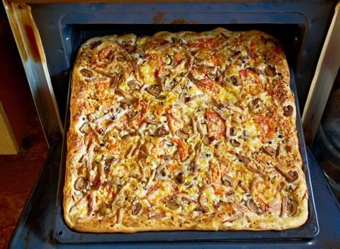 Large Rectangular pizza with meat Large Rectangular pizza with meat .Shall... Stock Photos