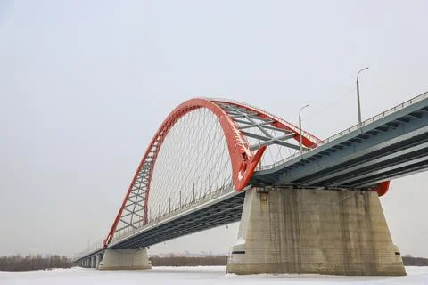 The large red arch bridge in winter close-up Stock Photos