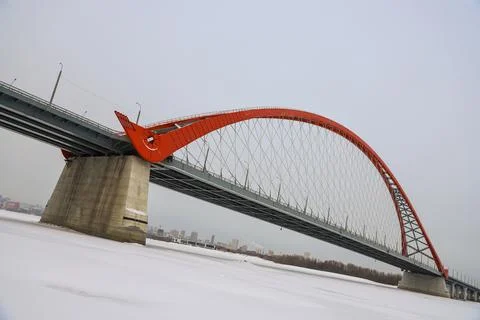 The large red arch bridge in winter close-up Stock Photos