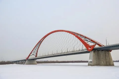 The large red arch bridge in winter close-up Stock Photos