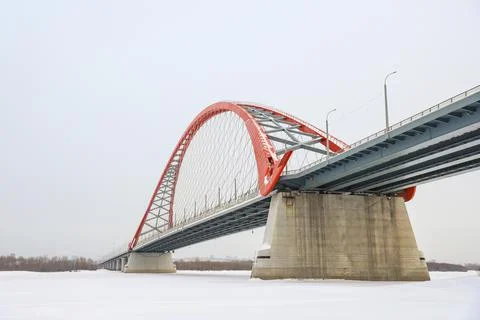 The large red arch bridge in winter close-up Stock Photos