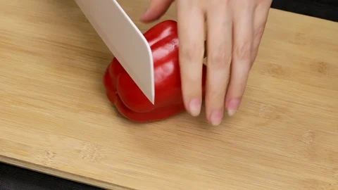 Large red bell peppers are separated and the core is removed. Stock Footage 107573754