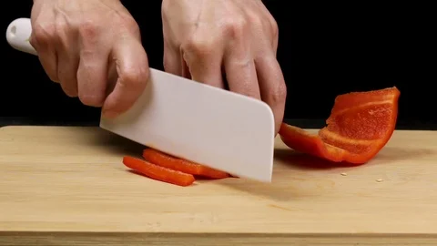 Large red bell peppers are separated and the core is removed. Stock Footage 107573899