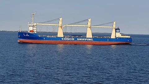 Large red blue and white bulk carrier with steel towers Stock Footage 113187878