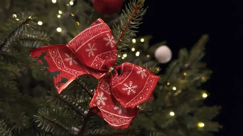 Large red bow decoration on the Christmas tree Stock Footage 324991733