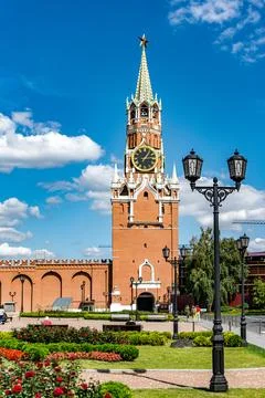 A large red building with a clock tower in Kremlin in Moscow Russia Stock Photos