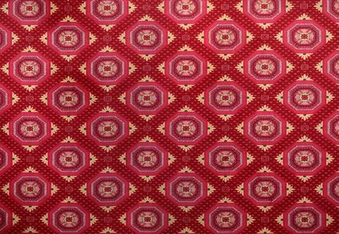 Large red carpet with checkered patterns Stock Photos