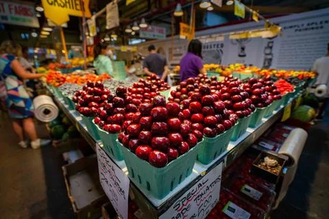 Large red cherries on corner of fruit stand in a market 스톡 사진