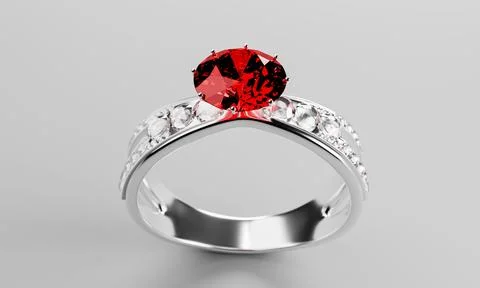 The large red diamond or ruby is surrounded by many diamonds on the ring ma.. Stock Photos