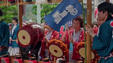 Large Red Drum in Foreground of Kimono-Clad Performers Stock Footage 342042398