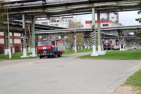 A large red fire-fighting rescue vehicle, a fire extinguishing truck, is on a 스톡 사진