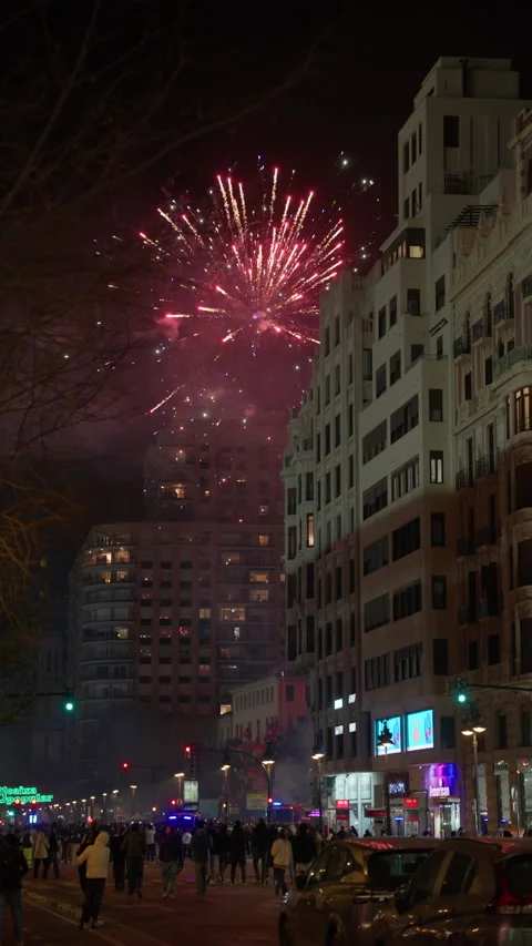 Large red firework explosion over Valencia street during Las Fallas celebration Stock Footage 336872578