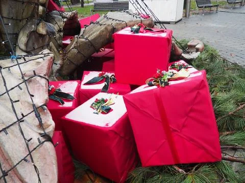 Large red gift boxes with elegant black ribbons and floral accents are arra.. Stock Photos