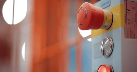 Large red industrial button, shiny chrome button and burning red light on panel Stock Footage 147634540